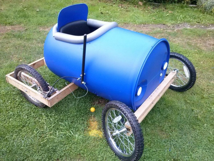 A homemade racing car with a plastic drum